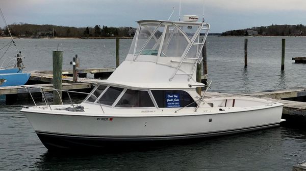 Bertram 31 Flybridge Cruiser Sitting at the Dock